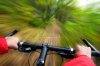 5773816-speed-on-mountainbike-biking-in-the-forest-motion-blurred-for-speed-effect.jpg