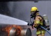 US_Navy_080730-N-5277R-003_A_Commander,_Naval_Forces_Japan_firefighter_douses_a_fire_on_a_dummy_.jpg